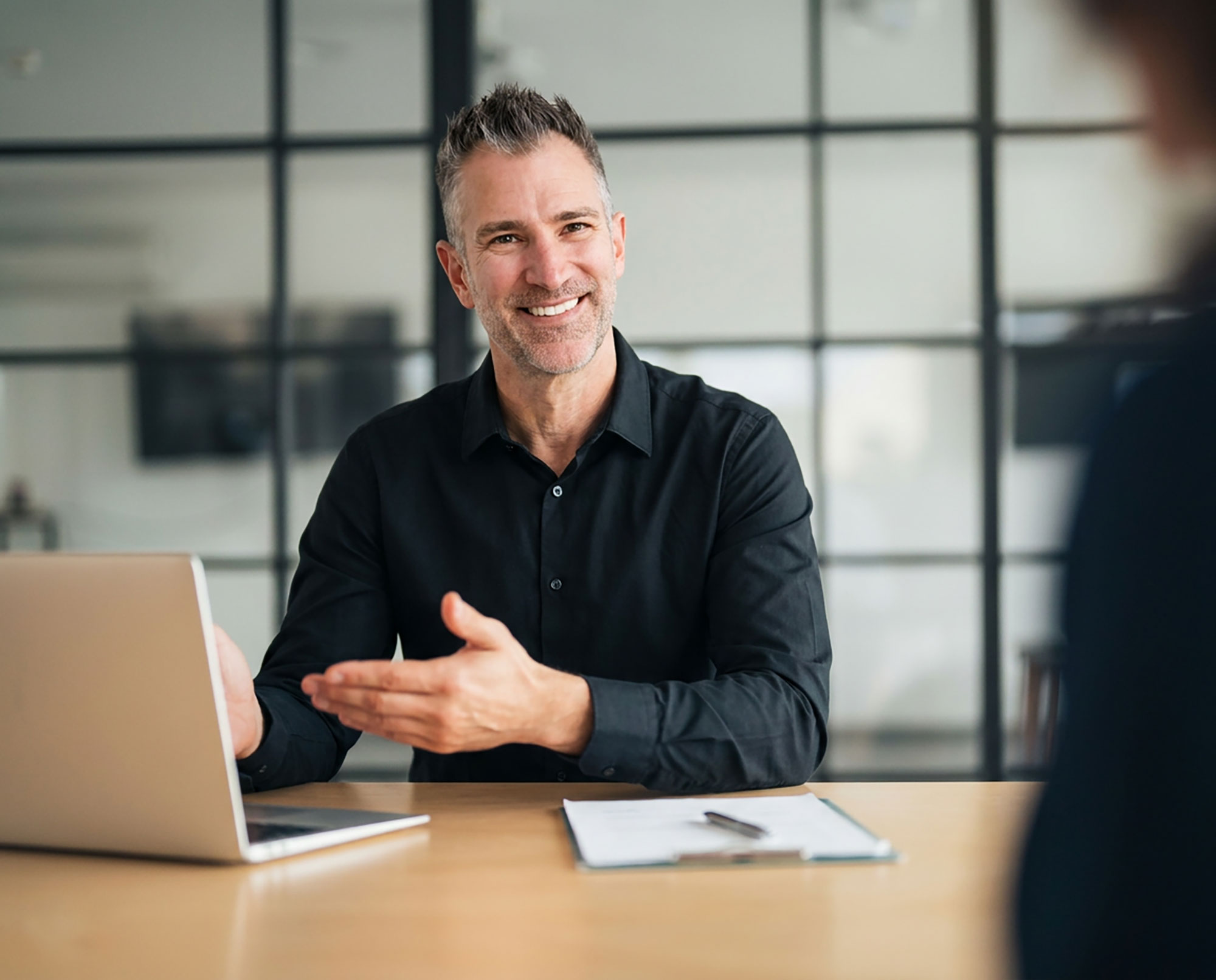 David Rymarz in a client meeting, Surface